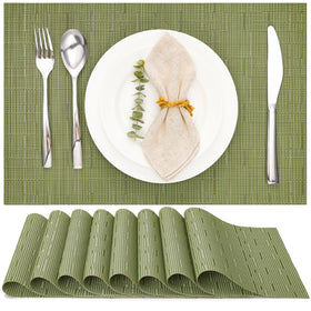 Myir JUN green placemats closeup highlighting durable PVC weave and smooth edge.