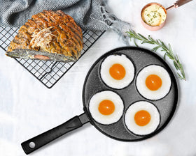 The included spatula beside the MyLifeUNIT egg pan for flipping.
