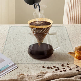 Mymonfif glass cutting board demonstrating heat resistance during prep.