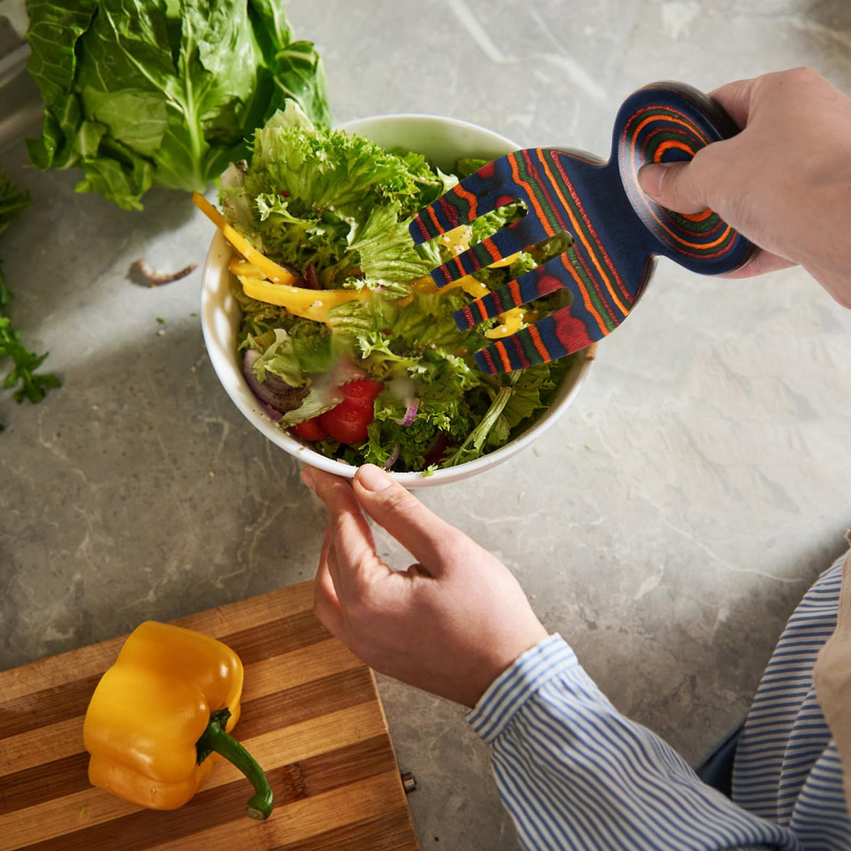MYRAINBOW Colorful teak salad tongs add vibrant table appeal.