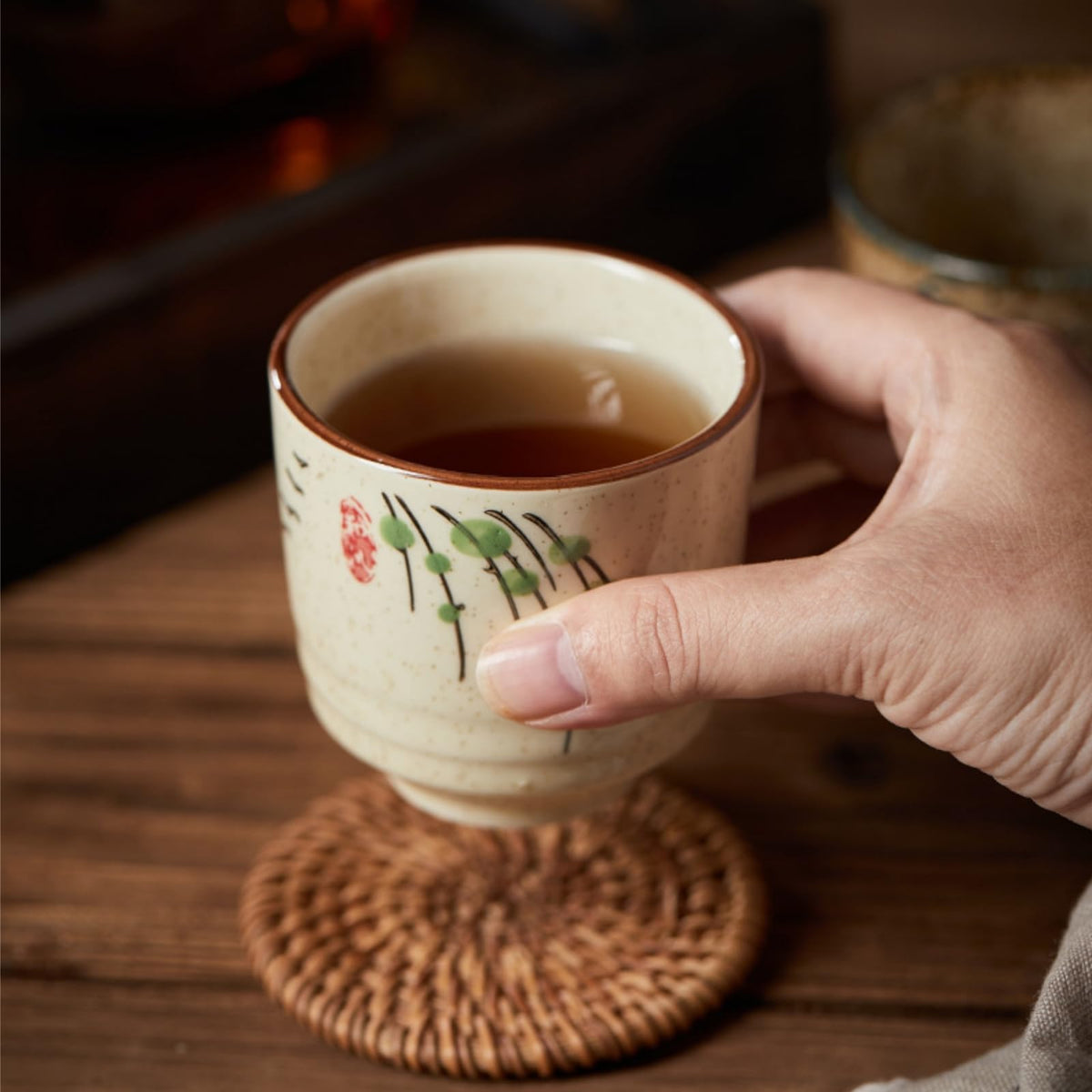 Nagpew textured ceramic teacup features thick walls for heat retention.
