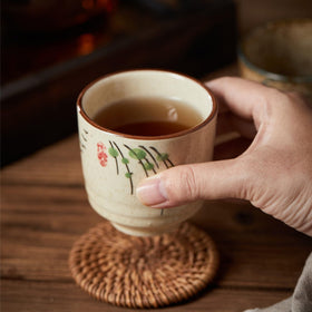 Nagpew textured ceramic teacup features thick walls for heat retention.