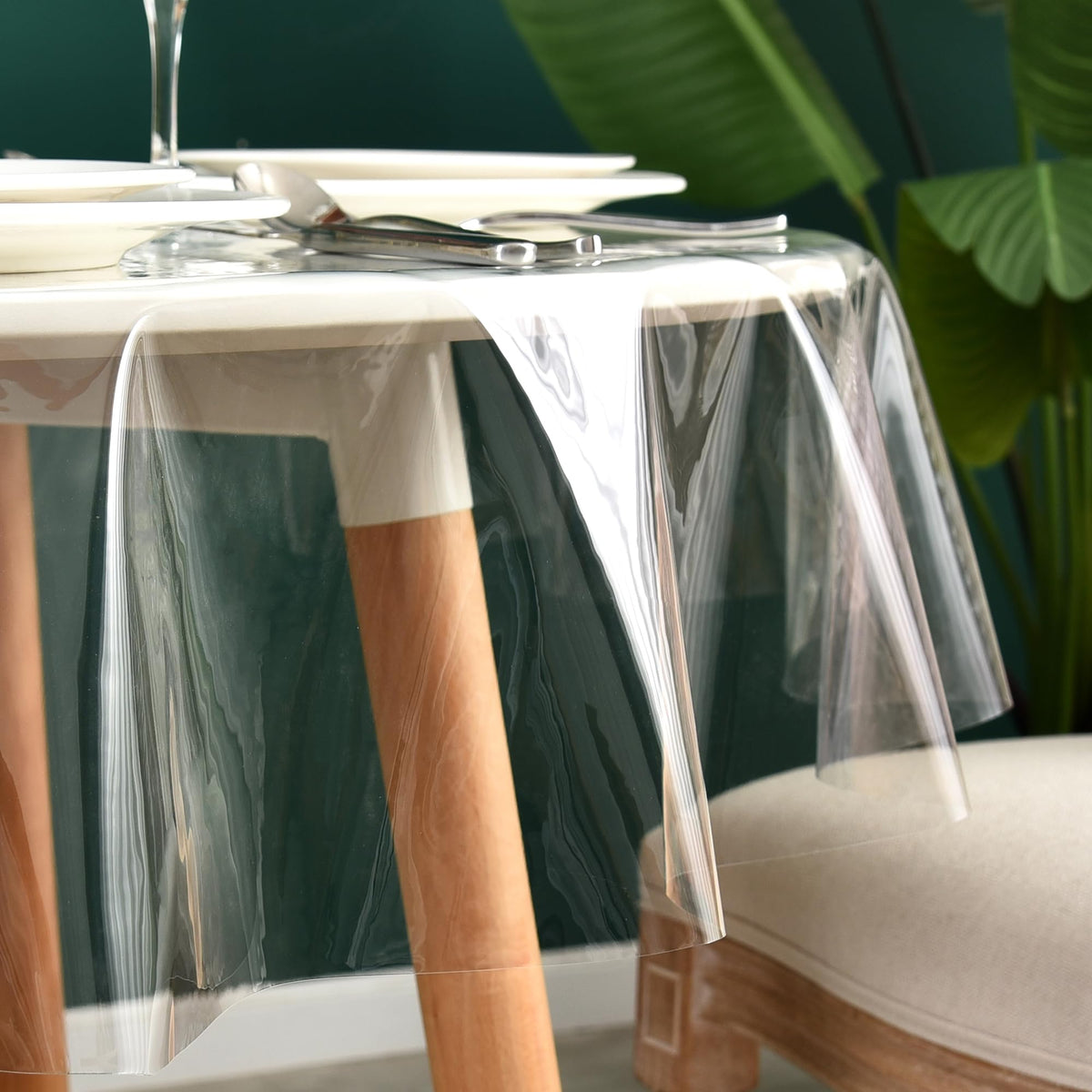 Nasitos waterproof table cover clear—prevents spills while preserving the table's look.