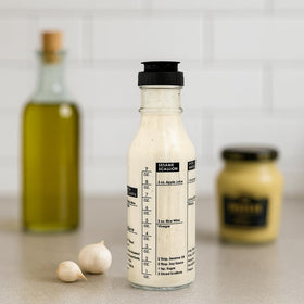 Natier salad dressing shaker pour-spout for smooth, drip-free pours.