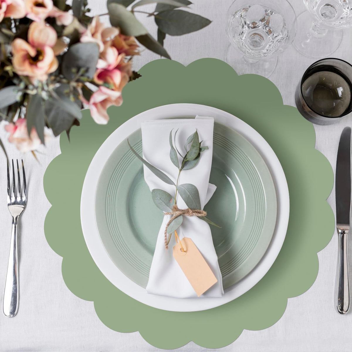 NatNarr sage-green placemat on dining table highlights clean, cohesive party styling
