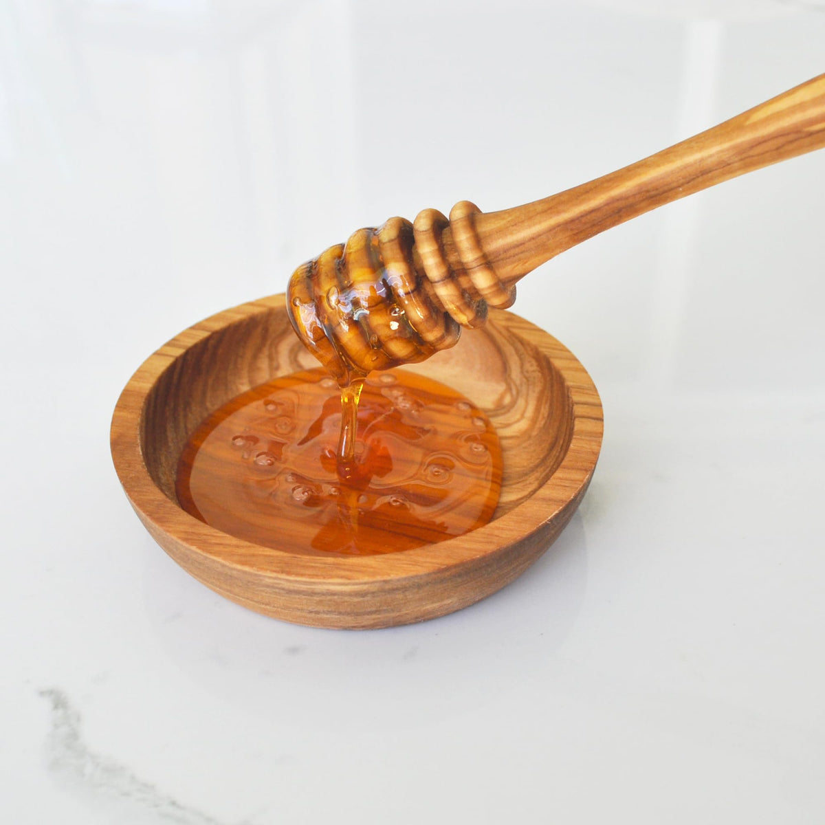 Naturally Med olive wood honey spoon in warm tones ideal for gifting.