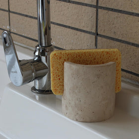 Nawgnail drying rack in travertine marble adds style while drying sponges.