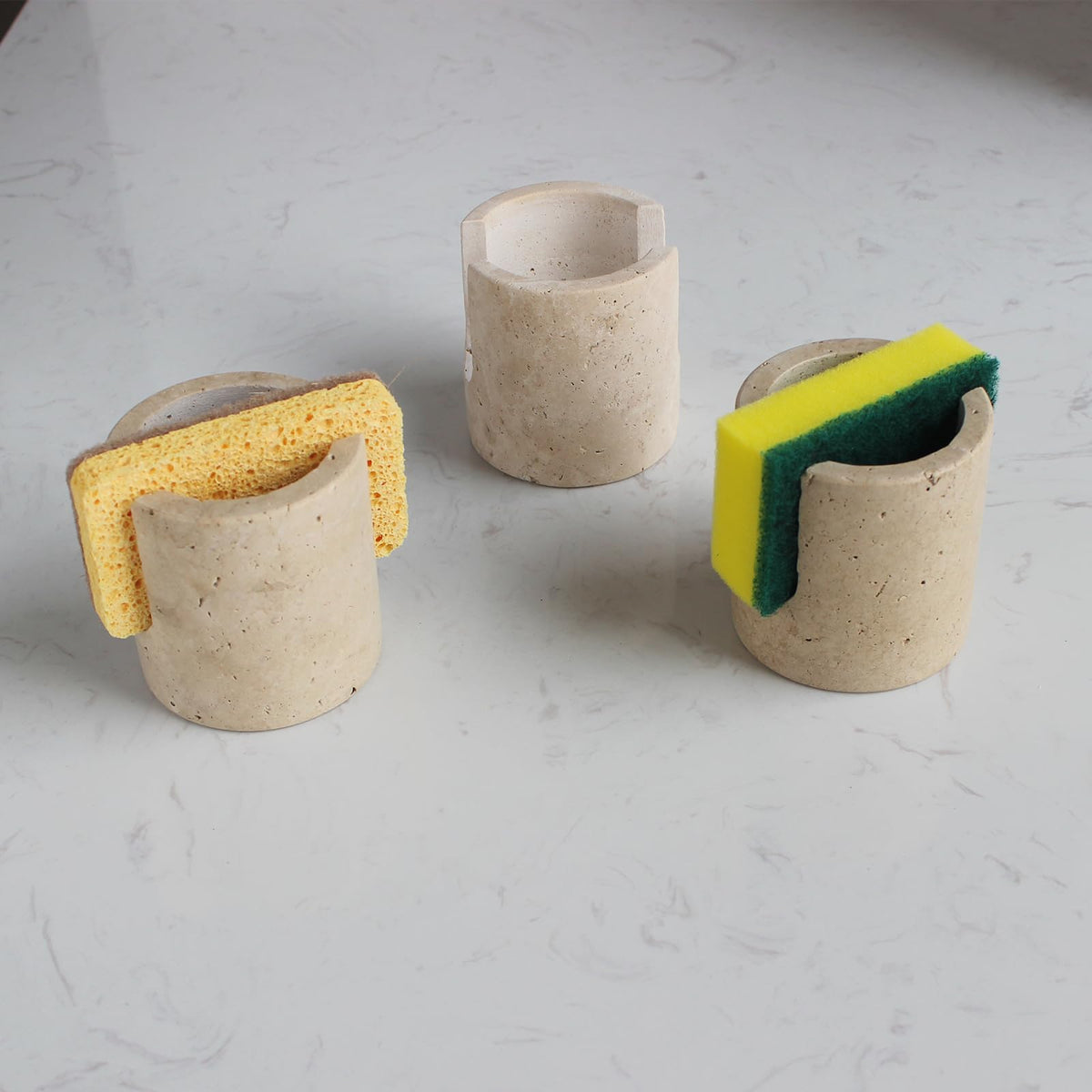 Nawgnail natural travertine sponge holder close-up showing a porous surface for quick drying.