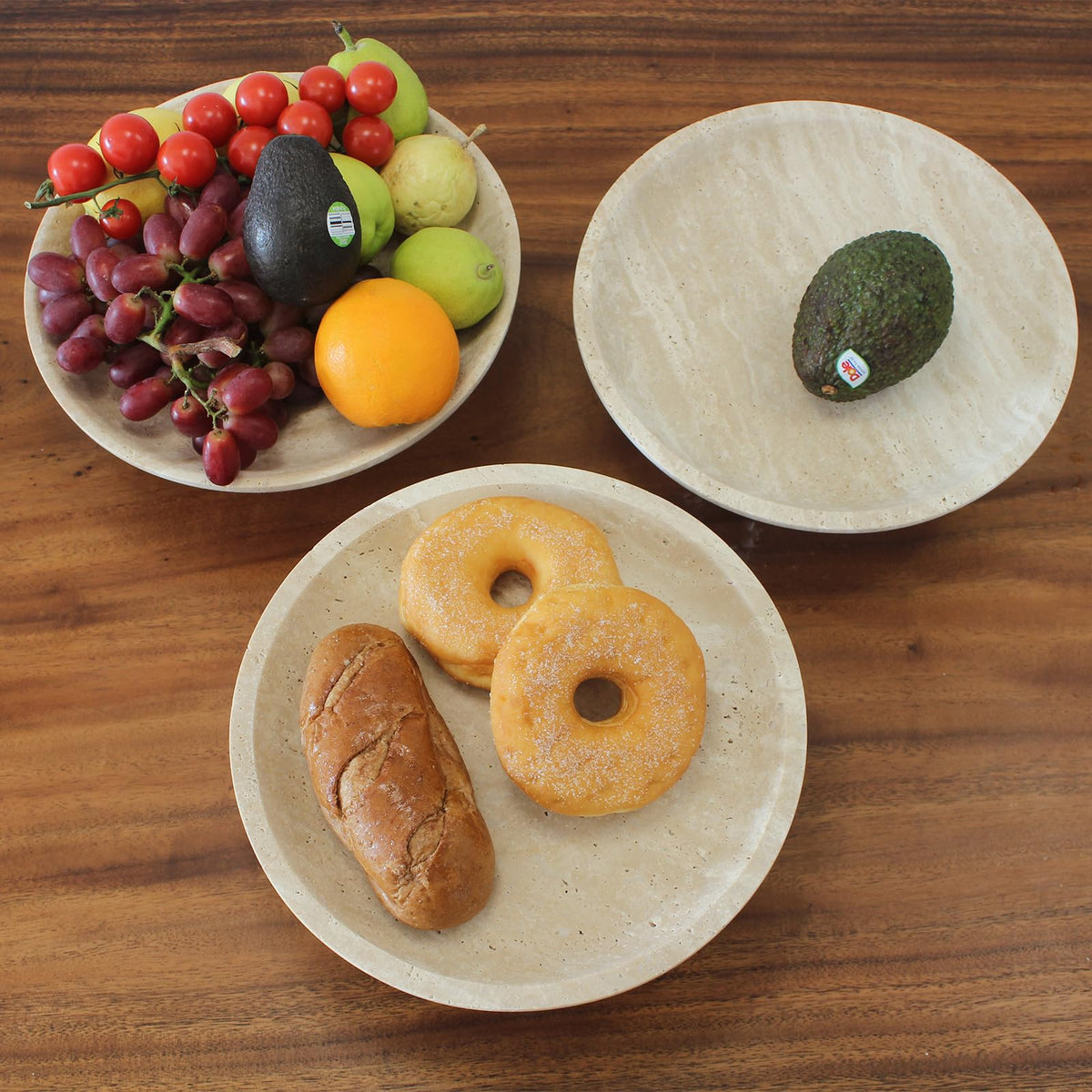 Nawgnail travertine fruit bowl on dining table as a festive centerpiece.