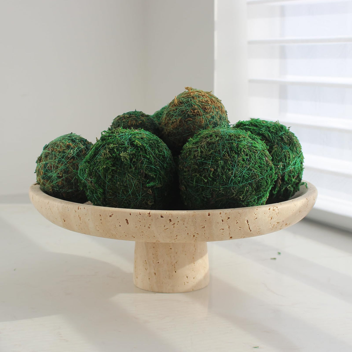 Nawgnail travertine fruit bowl on kitchen counter ready for produce.