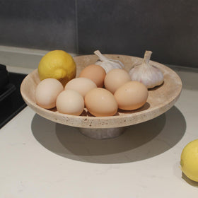 Nawgnail travertine fruit bowl pedestal detail shows natural texture.