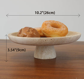 Nawgnail travertine fruit bowl side angle highlights pedestal design.