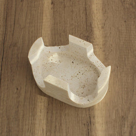 Nawgnail travertine near the sink offers rust-free storage