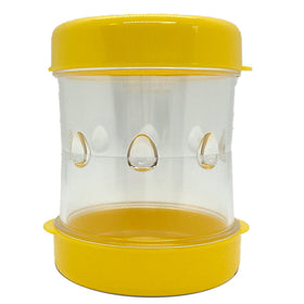NEGG boiled egg peeler with yellow cap ready for quick shell removal.
