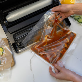 Removable drip tray makes cleanup quick after sealing.