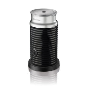 Nespresso Aeroccino 3 frother front view shows stainless steel and hot milk foam.