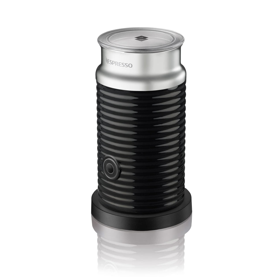 Nespresso Aeroccino 3 frother front view shows stainless steel and hot milk foam.