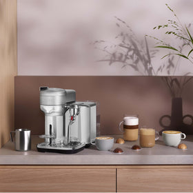 Barista steam wand creating latte art with rich microfoam