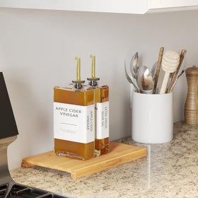 New England Stories elegant gold bottle set enhances countertop decor while keeping liquids handy