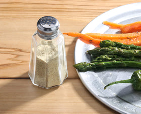 Jars fit securely on a caddy for organization.