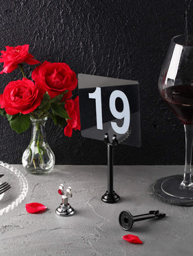 New Star Foodservice Triton Harp Clip Place Card Holder in black ideal for banquet card display and organization.