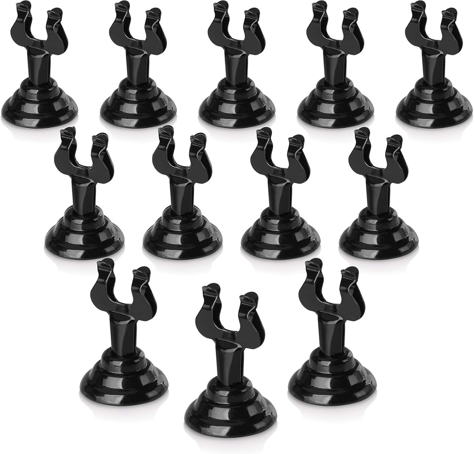 New Star Foodservice Triton Harp Clip Place Card Holder in black keeps cards upright for easy seating.