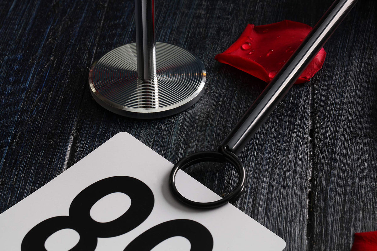Restaurant service utilizes 12-inch stands for high-visibility signage at tables.