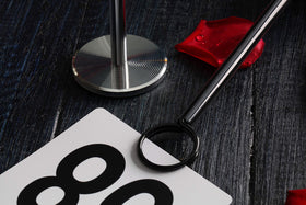 Restaurant service utilizes 12-inch stands for high-visibility signage at tables.