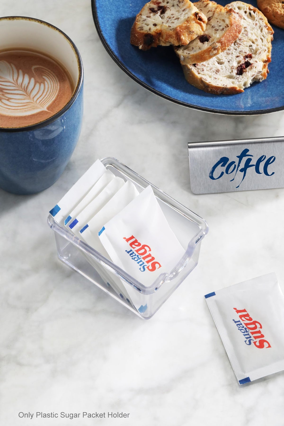 New Star sugar packet holder on tabletop keeps sweeteners reachable.