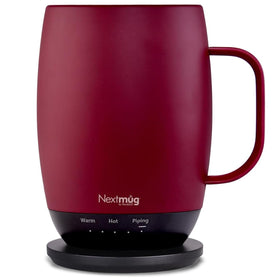 Nextmug Plus burgundy 18oz mug on desk maintaining beverage temperature