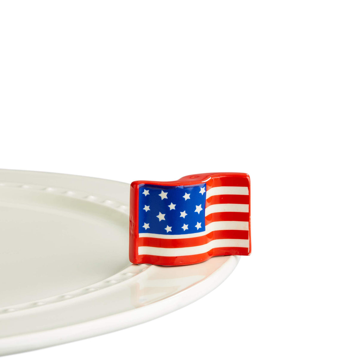 Nora Fleming American Flag A18 hand-painted mini decor adds seasonal charm to your table.