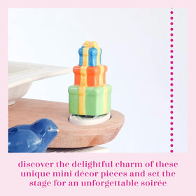 Nora Fleming ceramic mini with base detail for seasonal storytelling on shelves and desks.