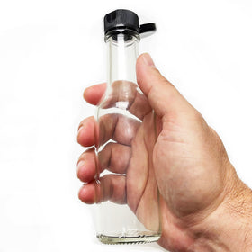 Nicebottles clear glass bottles display vibrant sauces during bottling.