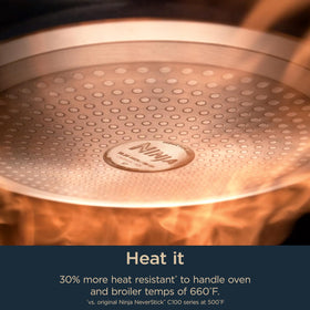 Ninja Ceramic Pro 550°F broil capability shown on a heat-safe pan surface.