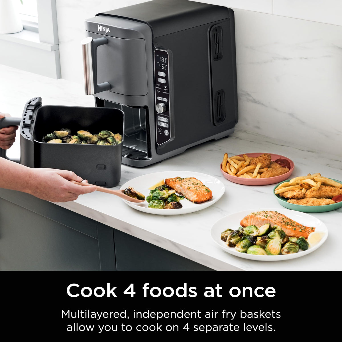 Ninja DoubleStack XL cooking four foods at once with stacked racks