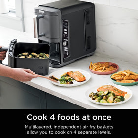 Ninja DoubleStack XL cooking four foods at once with stacked racks