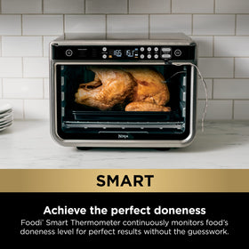 Ninja DT251 open-door view showing two-level capacity for sheet-pan meals.