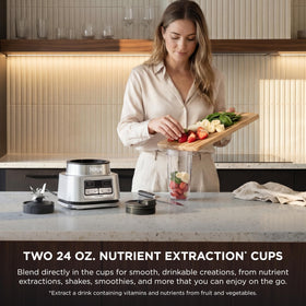 Ninja Foodi smoothie bowl maker with built-in tamper in action.