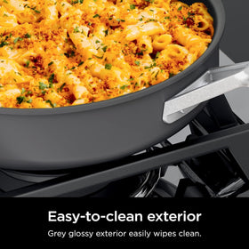 Ninja NeverStick Pro ergonomic handles show comfortable grip during use.