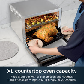 Ninja Prestige Smart XL air fryer oven digital display highlighting easy preheat and settings.