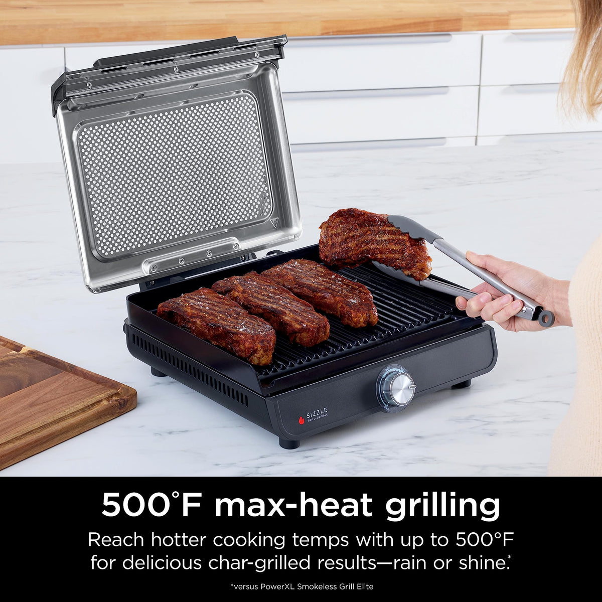 Ninja Sizzle searing steaks with high heat for flavorful char