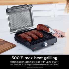 Ninja Sizzle searing steaks with high heat for flavorful char