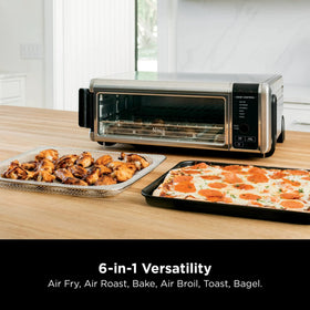 Ninja SP080 Foodi Digital Air Fry Oven open view illustrating easy access to meals.