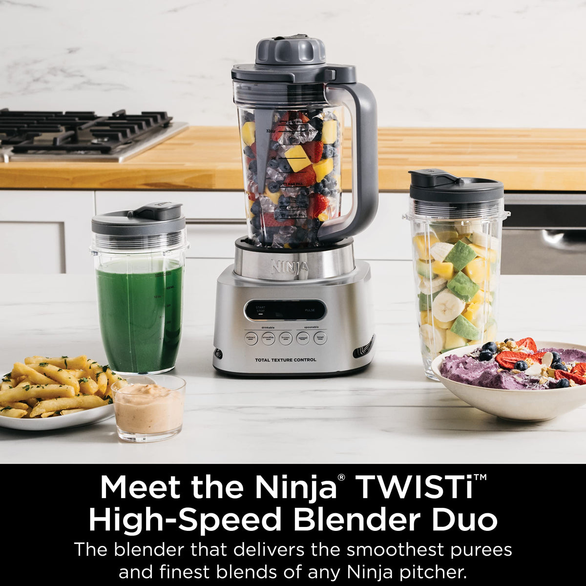 Ninja TWISTi blender tamper demonstrating built-in push-down blending action.