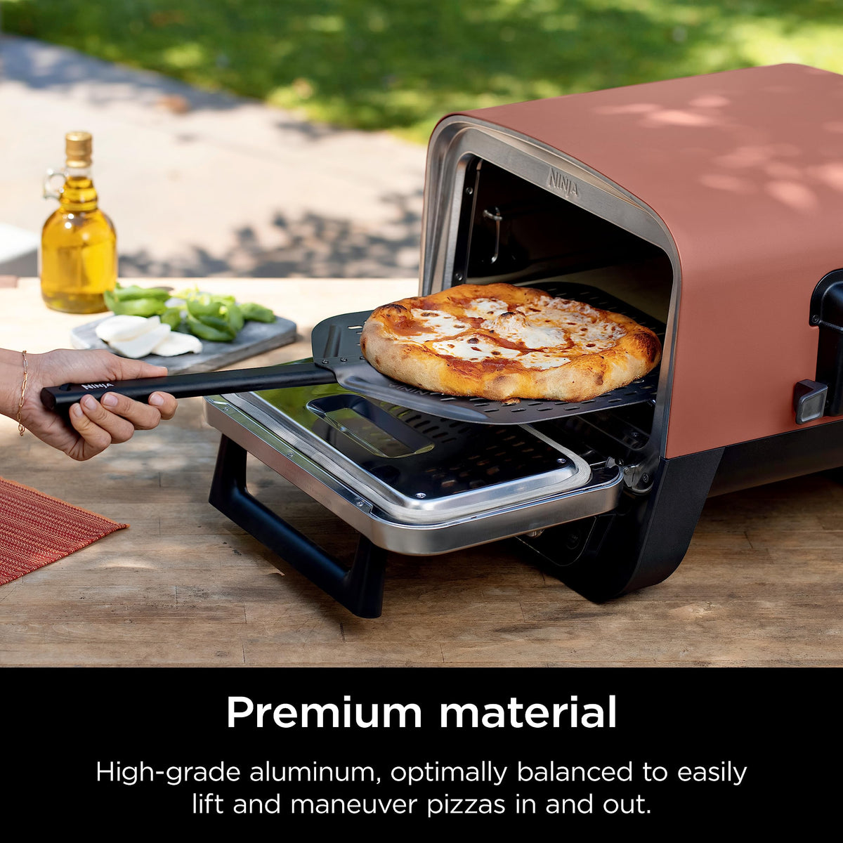 Ninja Woodfire aluminum pizza peel outdoors demonstrates rust-resistant, durable construction