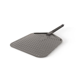 Ninja Woodfire perforated pizza peel close-up reducing flour buildup for clean transfers