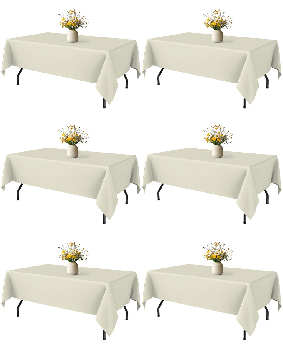 Niuara Ivory rectangle tablecloth on a 5ft table for a polished wedding setup