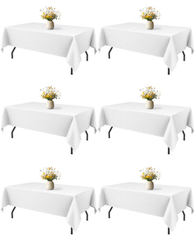 Niuara white rectangle table cloth draped on table for a clean, elegant look.