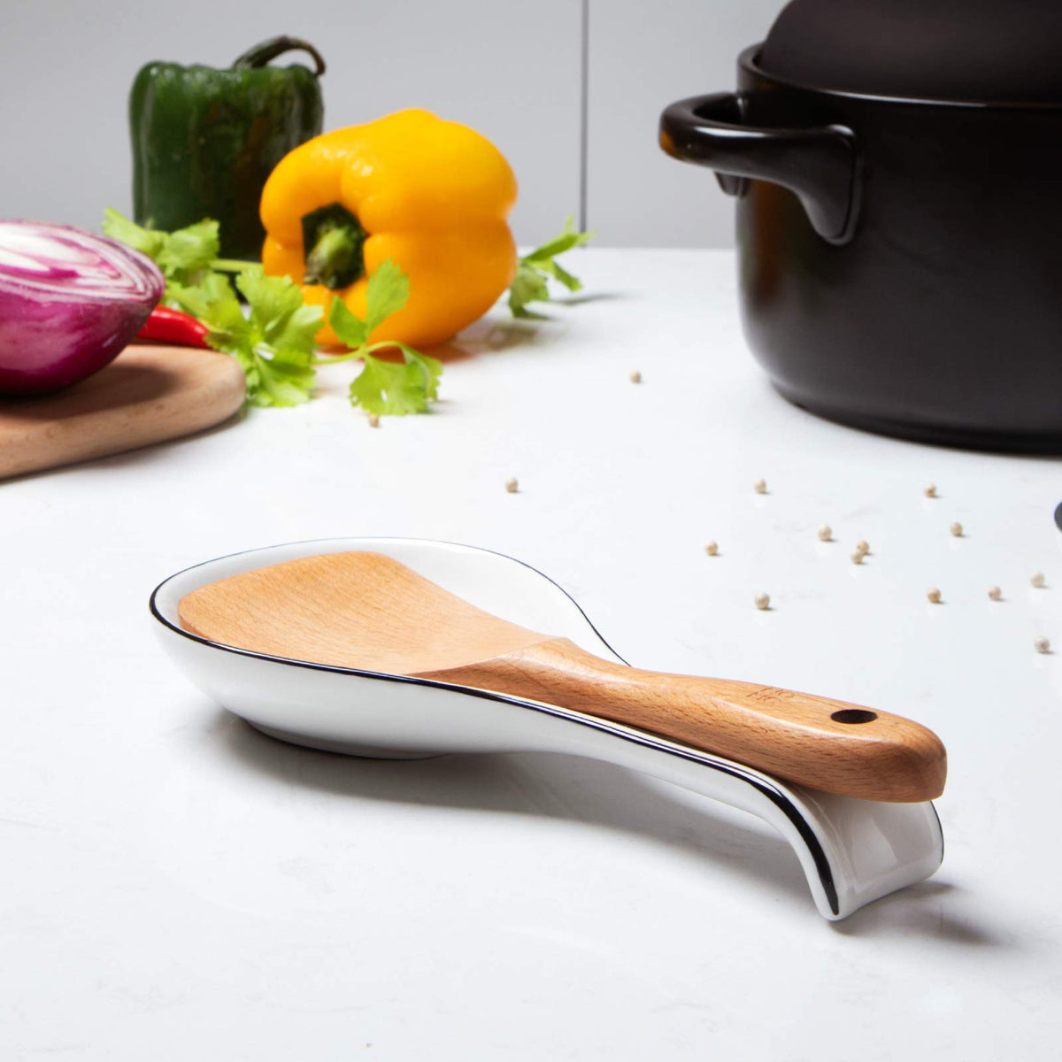 NJCHARMS spoon rest displayed in a modern farmhouse kitchen setting