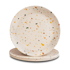 Nook Theory 4-pack bamboo plates on a table setting for kid-friendly meals.